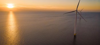 Offshore windfarm at sunset
