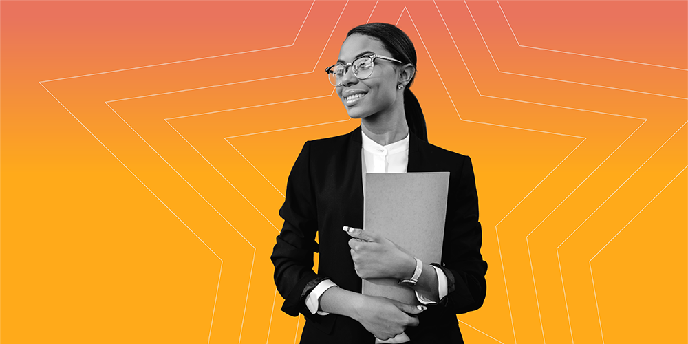 young professional woman with glasses holding a folder